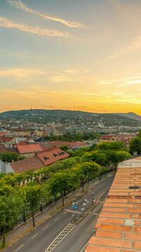 Budapest, Hungary - June 14, 2024: Sunset on Buda side, view from Arpad Toth Promenade. Time-lapse, slide transition, vertical orientation.