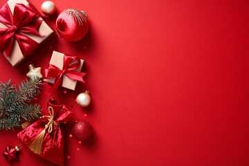 Christmas gifts and ornaments on a vibrant red background. Perfect for holiday season promotions and greeting cards