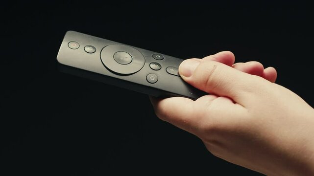 Adding silver batteries AA and AAA in remote controller TV close-up. Batteries are common in portable electronic devices. An AA battery is composed of a single electrochemical cell that may be either