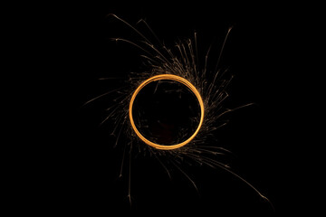 Circular lights with sparks on a black background