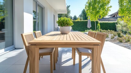 Fototapeta premium Modern Outdoor Dining Table in Bright Garden Setting