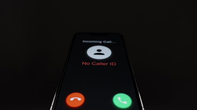 An incoming call with "No Caller ID," educating on the dangers of answering anonymous calls. Dolly slider, close up.