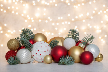 A bunch of Christmas ornaments are on a table