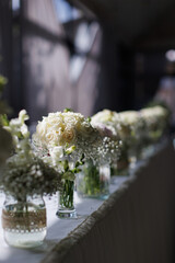 Elegant wedding table arrangement with candles and flowers