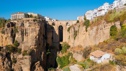 Aerial photo from drone to Puente Nuevo (The New Bridge)  over Guadalevin River in Ronda medieval town sunset. Ronda, Andalusia, Spain.