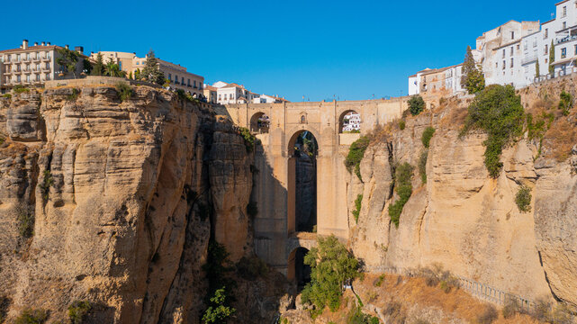 Aerial photo from drone to Puente Nuevo (The New Bridge)  over Guadalevin River in Ronda medieval town sunset. Ronda, Andalusia, Spain.