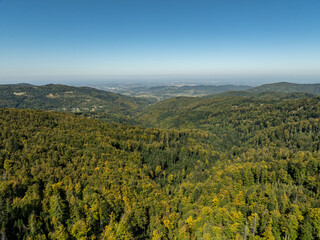 Fototapeta premium Beskid Maly aerial panorama of potrojna hill and czarny gron.Little Beskids mountain range in summer.Aerial drone view of Rzyki Village in Beskid Maly Poland.Czarny gron ski resort in Rzyki.