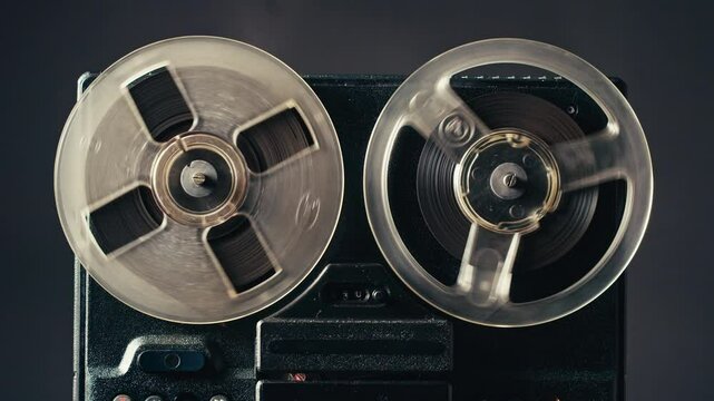 Tape audio music player, studio magnetic tape, vintage retro spool reel to reel player and recorder, magnetic tape data storage close up, music studio. 