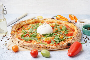 Tasty pizza with Burrata cheese on table
