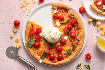 Plate of tasty pizza with Burrata cheese on pink tile background