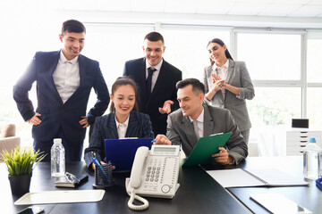 Business people negotiating at table in conference hall