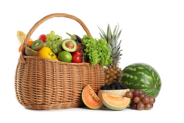 Different fresh vegetables and fruits in wicker basket isolated on white