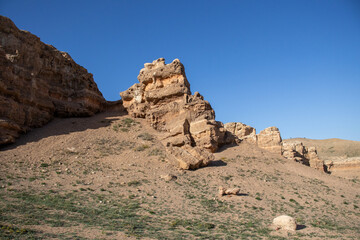 Fototapeta premium A stunning Charyn canyon in the desert beneath a bright blue sky