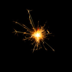 Christmas sparkler burning isolated on black background...