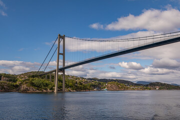 Passing Under the Askøy Suspension Bridge Across the Byfjorden, From the deck of a cruise ship leaving Bergen, Norway in Summer