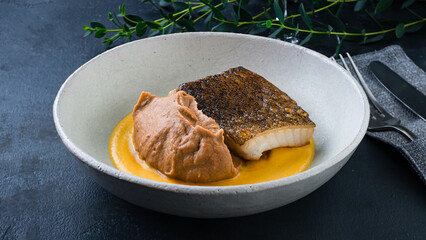Lunch fried fish with sauce and spices in plate.