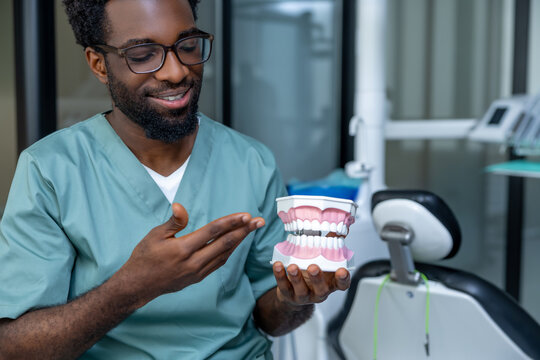 Stomatologist showing routine check of dental hygiene, focusing on prevention