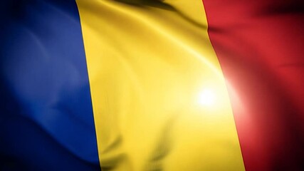 The Romanian flag prominently displays its blue, yellow, and red stripes, gently waving in the air while illuminated by soft light, symbolizing national pride and unity