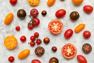 Different fresh tomatoes on white background