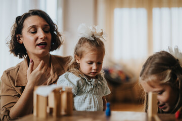 A mother and her two daughters enjoy quality time at home, playing and bonding. The image captures warmth, family, and happiness.
