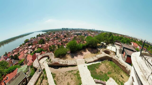 Aerial drone view of Gardos Tower in Belgrade, constructed in 1896 during the Austro-Hungarian era, highlighting the Zemun district of Belgrade, Serbia, with the Danube River in the background.