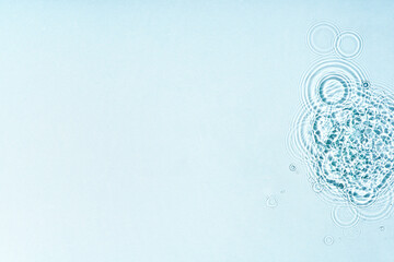Gentle ripples form on a serene blue surface