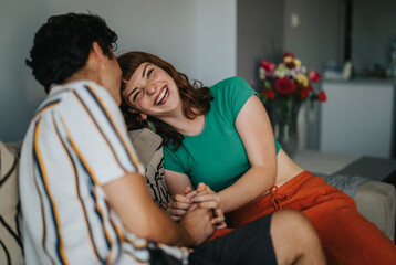 A joyful moment with friends laughing and sharing a fun time together, showcasing happiness and...