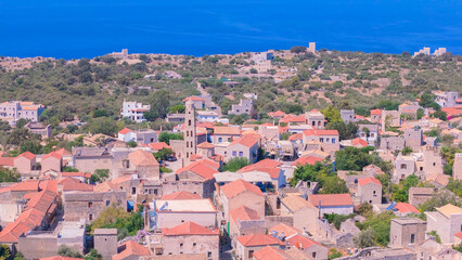 Fototapeta premium greece peloponnese region limeni town seaside and architecture stone houses beaches and church aerial view