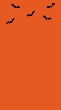 animation of bats flying on orange background, halloween background, vertical video