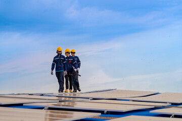 engineer man inspects construction of solar cell panel or photovoltaic cell by electronic device....