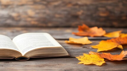An open book lies on a wooden table surrounded by colorful autumn leaves, inviting reflection on a crisp fall day