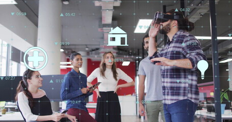 Virtual reality and healthcare image over diverse team in modern office