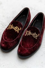 Elegant burgundy velvet loafers with gold embroidered design