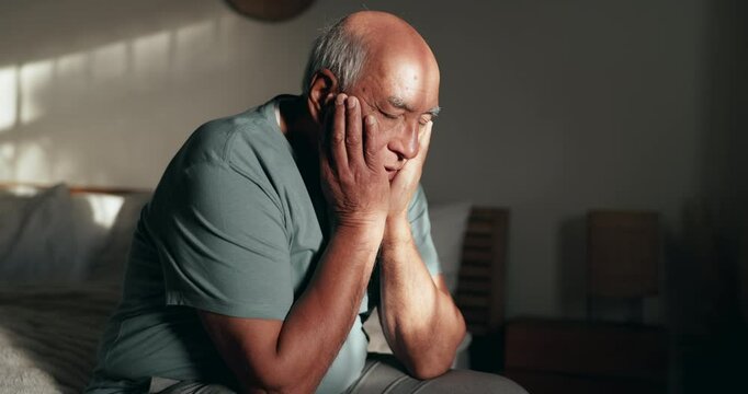 Bedroom, headache and thinking with senior man, house and depression with mental health. Anxiety, pensioner and elderly guy sitting on bed, thoughts and migraine with retirement, lonely and stress