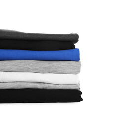 Stack of clean colorful t-shirts isolated on white