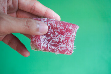 Hand holding of colorful layer cake
