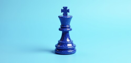 A striking blue chess king piece set against a vibrant background, symbolizing strategy, competition, and leadership in business contexts.