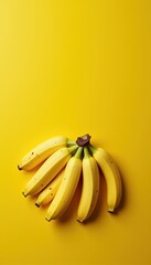 Fresh and vibrant bunch of bananas on a bright yellow background, perfect for healthy eating, nutrition, or fruit-related marketing campaigns.
