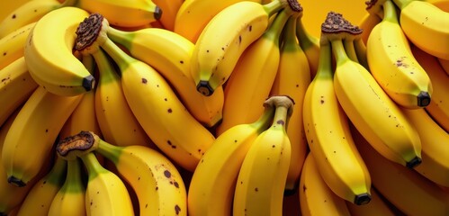 A vibrant close-up of fresh yellow bananas, perfect for illustrating nutrition, health, and fresh produce concepts.