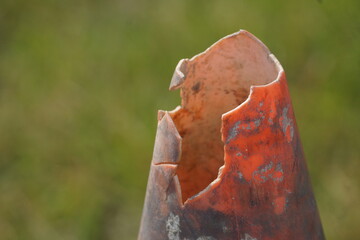 Close up of dirty broken traffic cone tip
