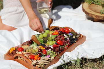 person eating charcuterie 