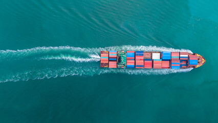 Cargo container ship carrying container and running out international container port customs shipyard sea port concept smart logistic service.