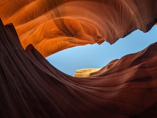 Bright orange rock texture with clear blue sky