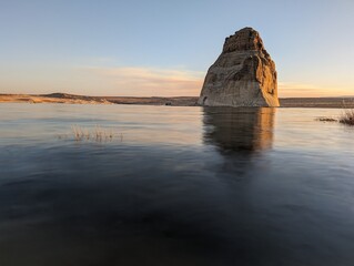 Calm water during sunset on Lake Powell at Lone Rock Beach in Glen Canyon National Recreation Area, Utah.