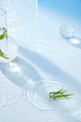 The advertisement features a product display on a lake surface, petri dishes, green branch flasks, glass balls, and water-colored glass panels on a light blue background.