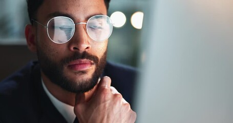 Reading, computer and businessman in office at night for corporate budget report deadline. Thinking, glasses and male financial analyst working overtime for company investment analysis on desktop.