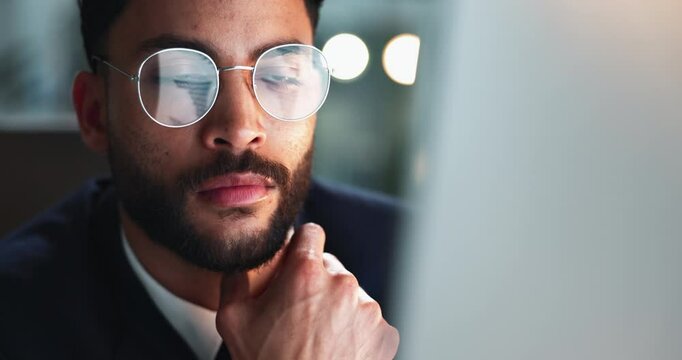 Reading, computer and businessman in office at night for corporate budget report deadline. Thinking, glasses and male financial analyst working overtime for company investment analysis on desktop.