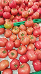 A healthy food, large and very fresh red tomatoes in a one of supermarket