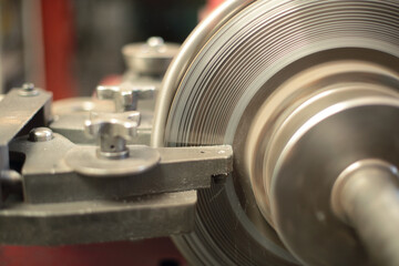 Brake disc is ground on lathe