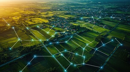 Aerial view of fields and urban sprawl, marked with network nodes for land development.